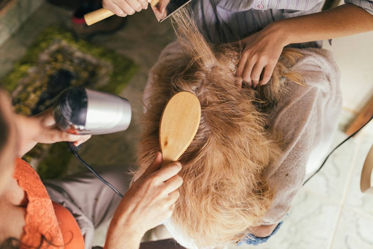 Diagram showing cross-section of hair shaft with salon treatment penetrating cortex vs. at-home mask coating surface