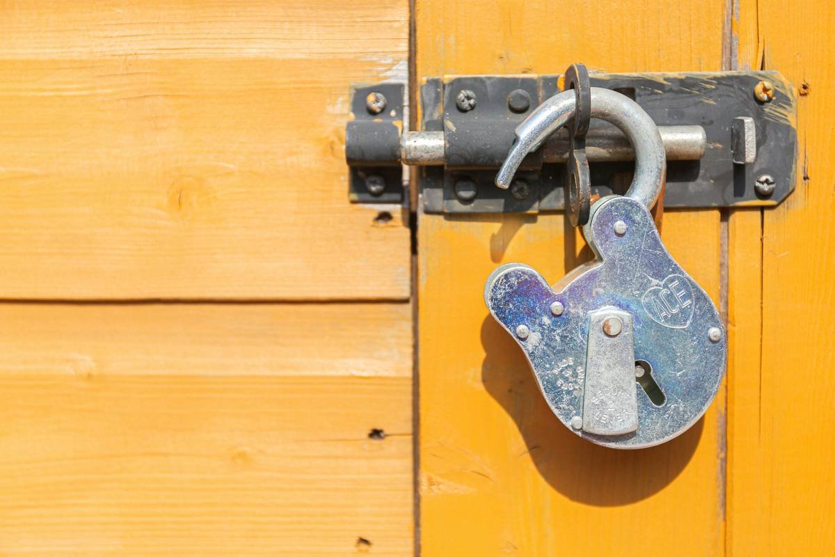 Unlocked old fashioned padlock. Just when will lockdown end?
